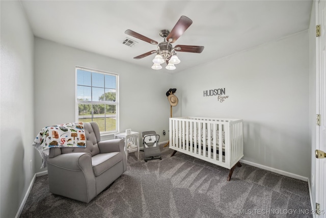 bedroom featuring carpet floors, baseboards, ceiling fan, and a nursery area