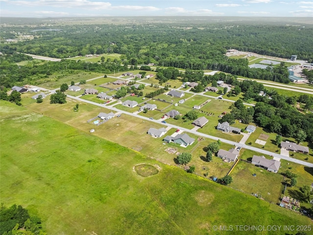 aerial view of property's location with a forest
