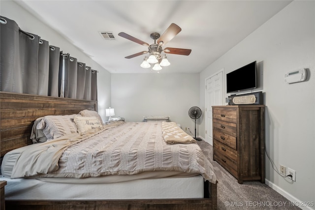 carpeted bedroom with baseboards and a ceiling fan