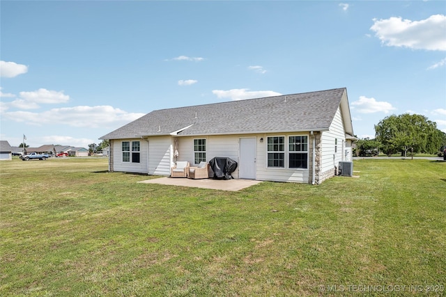 back of property with central AC, a patio, a yard, and an outdoor living space