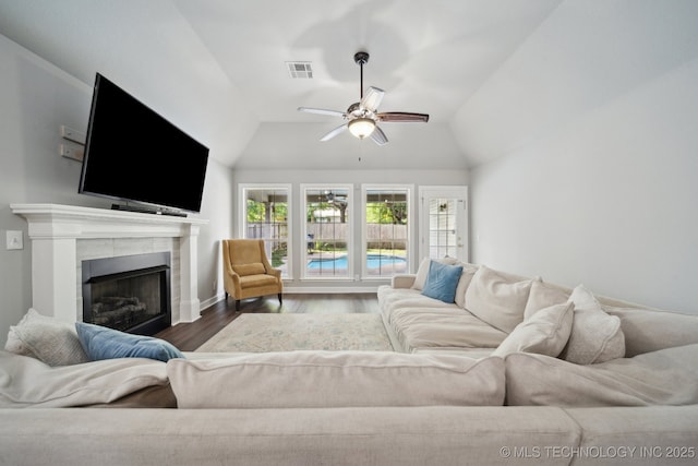 1414 W 114th St, Jenks, OK 74037 - living room with wood finished floors, ceiling fan, lofted ceiling, a fireplace, and baseboards