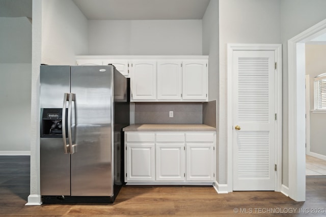 1414 W 114th St, Jenks, OK 74037 - kitchen featuring stainless steel fridge, white cabinets, light countertops, and wood finished floors