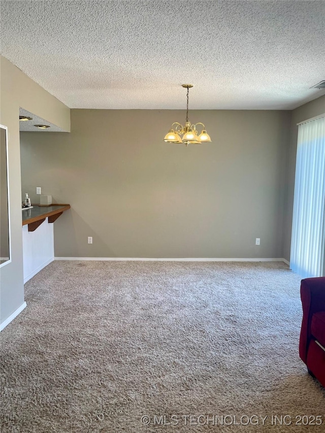 3164 S 101st E Ave Unit 801, Tulsa, OK 74146 - unfurnished dining area featuring carpet floors, a chandelier, a textured ceiling, and baseboards