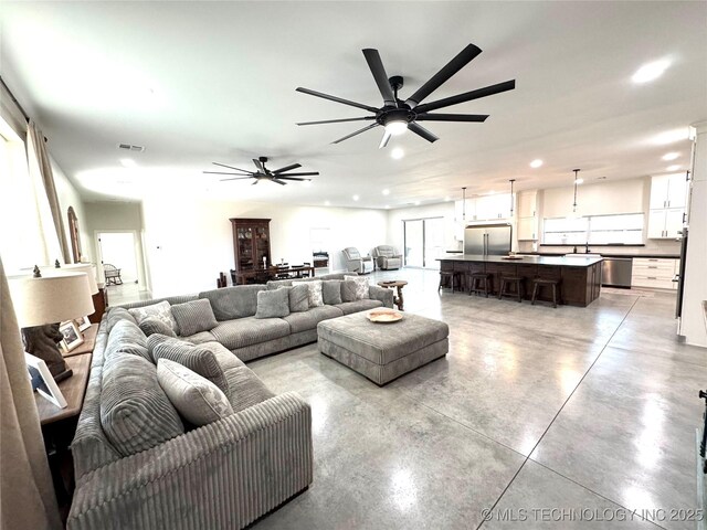 116645 S 4215th Rd, Eufaula, OK 74432 - living room featuring concrete flooring, a ceiling fan, and recessed lighting