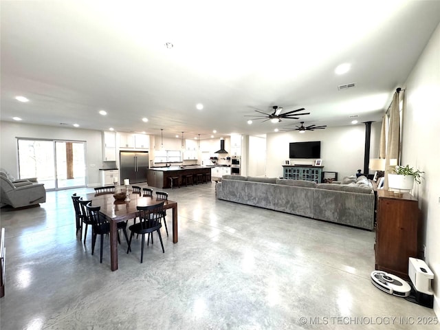 116645 S 4215th Rd, Eufaula, OK 74432 - dining space featuring finished concrete floors, a ceiling fan, and recessed lighting