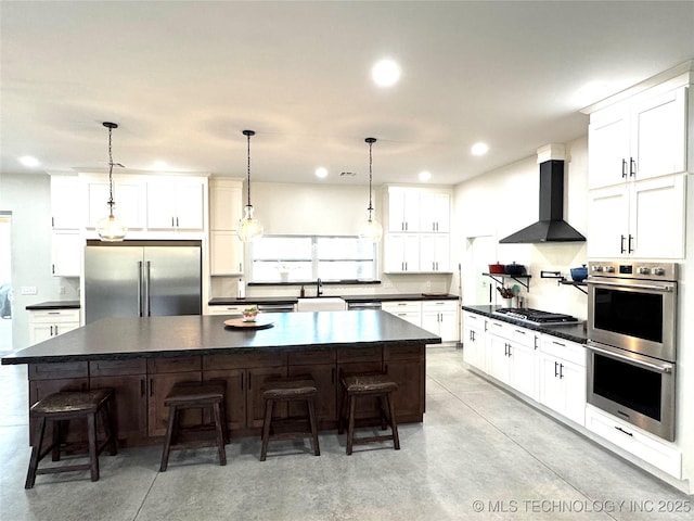 116645 S 4215th Rd, Eufaula, OK 74432 - kitchen featuring stainless steel appliances, wall chimney range hood, dark countertops, concrete floors, and recessed lighting