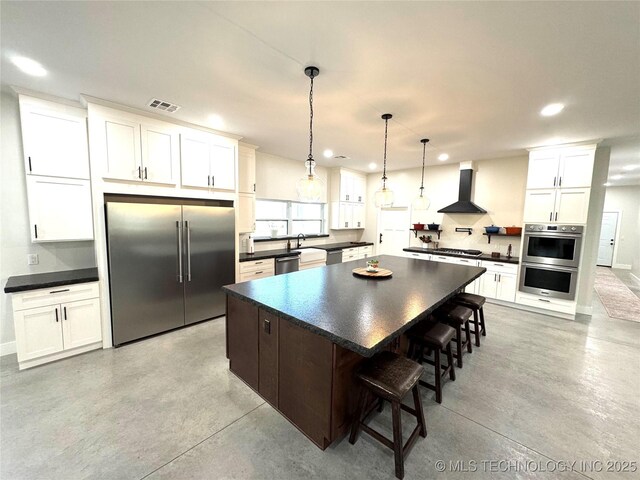 116645 S 4215th Rd, Eufaula, OK 74432 - kitchen featuring stainless steel appliances, wall chimney exhaust hood, dark countertops, and recessed lighting
