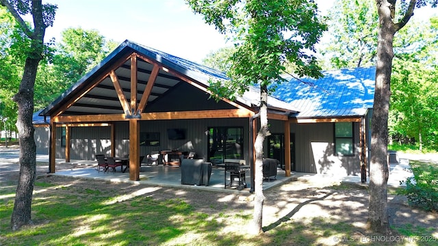 116645 S 4215th Rd, Eufaula, OK 74432 - rear view of house with a patio area and metal roof