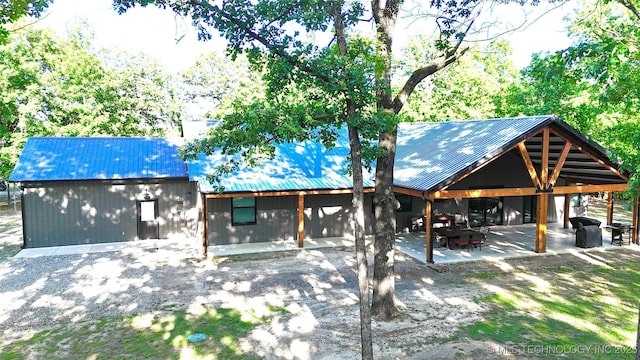 116645 S 4215th Rd, Eufaula, OK 74432 - view of front of house with metal roof and a patio area