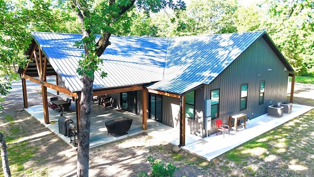 116645 S 4215th Rd, Eufaula, OK 74432 - back of property with a patio, metal roof, and central AC