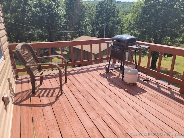 363 W 1700th Rd, Stigler, OK 74432 - wooden terrace featuring a view of trees