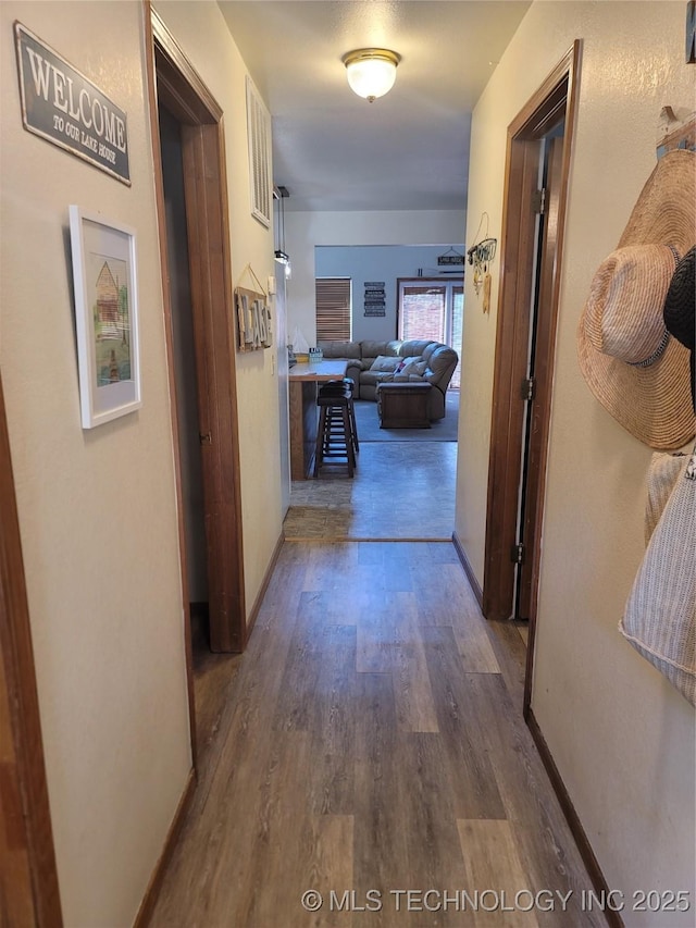363 W 1700th Rd, Stigler, OK 74432 - corridor featuring wood finished floors and baseboards