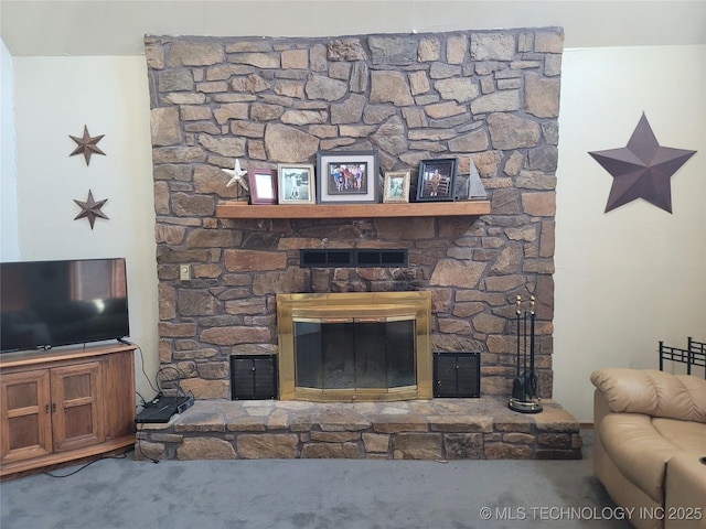 363 W 1700th Rd, Stigler, OK 74432 - carpeted living area with a glass covered fireplace