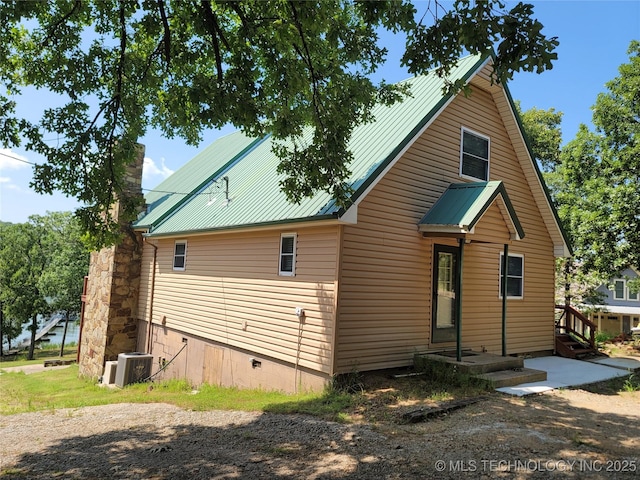 363 W 1700th Rd, Stigler, OK 74432 - view of front of property with metal roof, a chimney, crawl space, and central AC