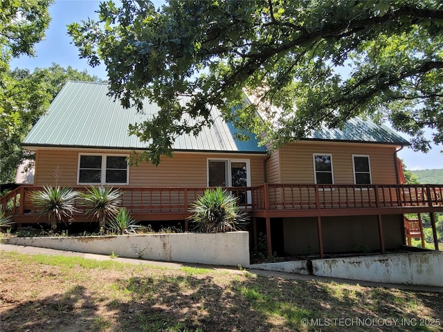 363 W 1700th Rd, Stigler, OK 74432 - view of front facade with a wooden deck and metal roof