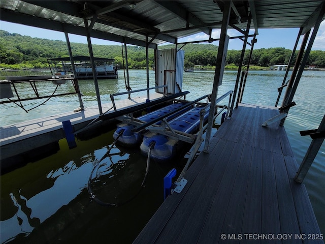 363 W 1700th Rd, Stigler, OK 74432 - dock with boat lift, a water view, and a view of trees