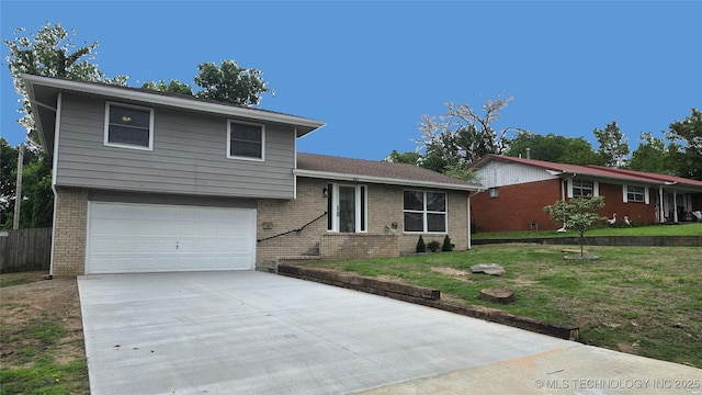 411 S 3rd, Eufaula, OK 74432 - split level home featuring brick siding, driveway, and a garage