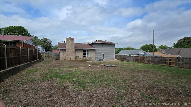 411 S 3rd, Eufaula, OK 74432 - back of property with a chimney, entry steps, and brick siding
