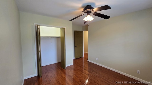 411 S 3rd, Eufaula, OK 74432 - unfurnished bedroom featuring a closet, wood finished floors, baseboards, and a ceiling fan