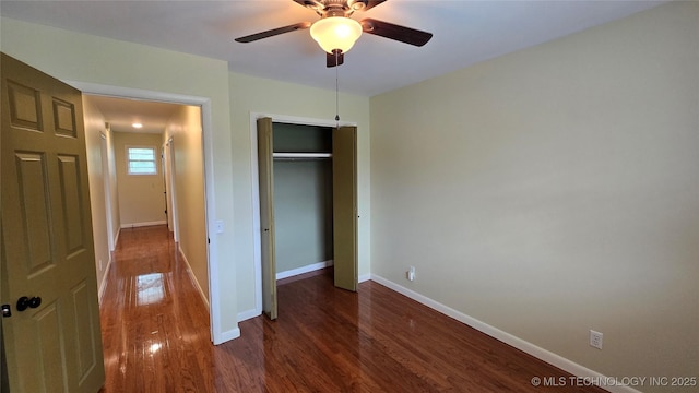 411 S 3rd, Eufaula, OK 74432 - unfurnished bedroom featuring wood finished floors, baseboards, a closet, and a ceiling fan
