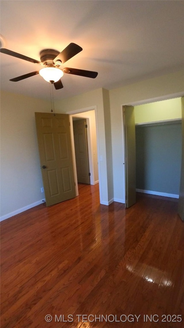 411 S 3rd, Eufaula, OK 74432 - unfurnished bedroom with wood finished floors, baseboards, and a ceiling fan