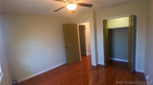411 S 3rd, Eufaula, OK 74432 - unfurnished bedroom with wood finished floors, baseboards, and ceiling fan