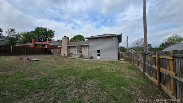 411 S 3rd, Eufaula, OK 74432 - rear view of house with entry steps, central AC, and a chimney