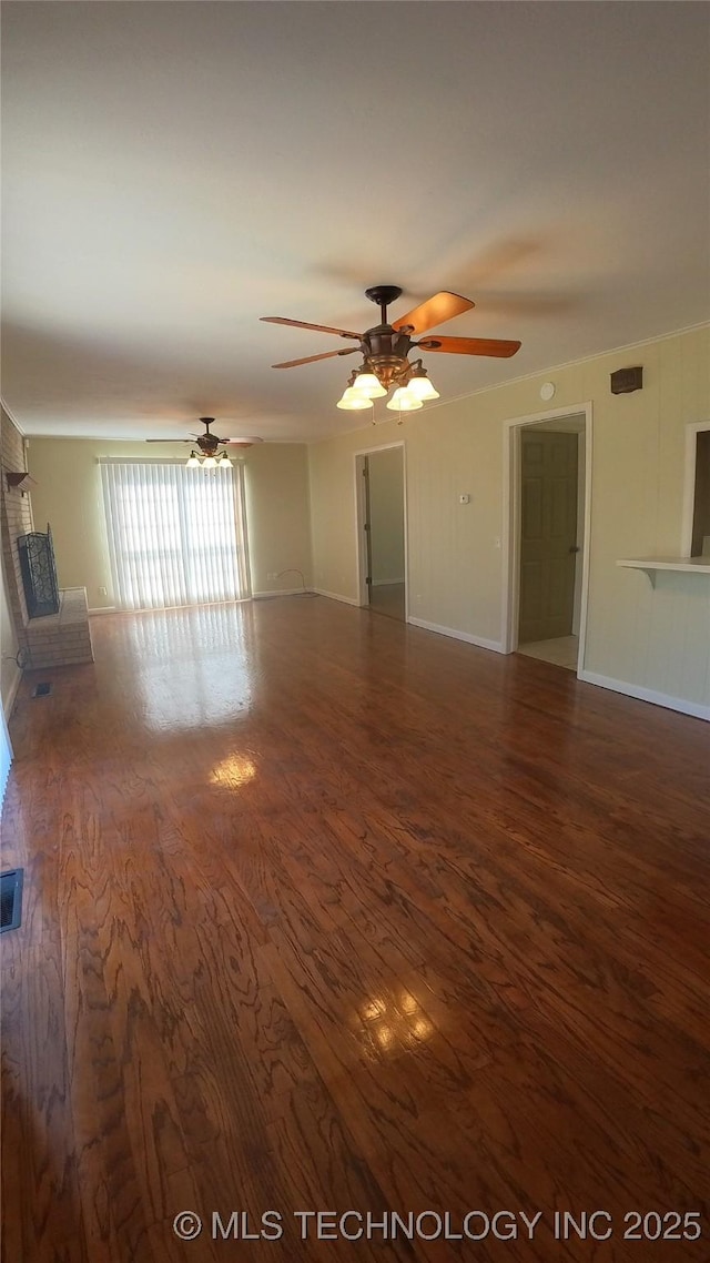 411 S 3rd, Eufaula, OK 74432 - unfurnished living room with wood finished floors, ceiling fan, and baseboards