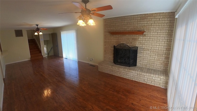 411 S 3rd, Eufaula, OK 74432 - unfurnished living room featuring a ceiling fan, baseboards, wood finished floors, stairway, and ornamental molding
