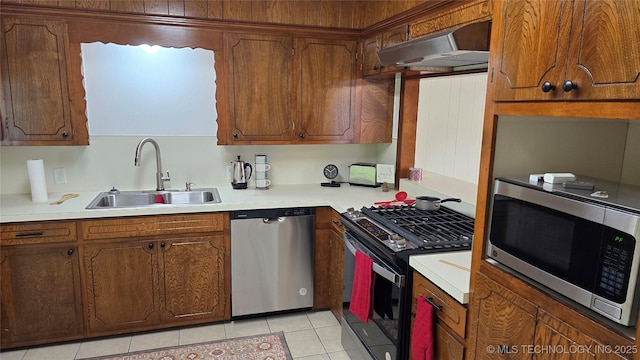 411 S 3rd, Eufaula, OK 74432 - kitchen with appliances with stainless steel finishes, a sink, under cabinet range hood, and light countertops