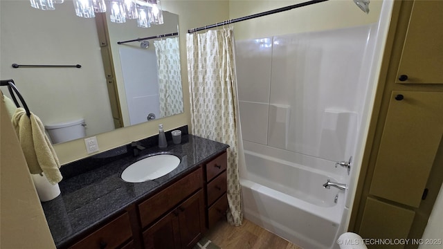 411 S 3rd, Eufaula, OK 74432 - bathroom with wood finished floors, vanity, and shower / bath combo with shower curtain