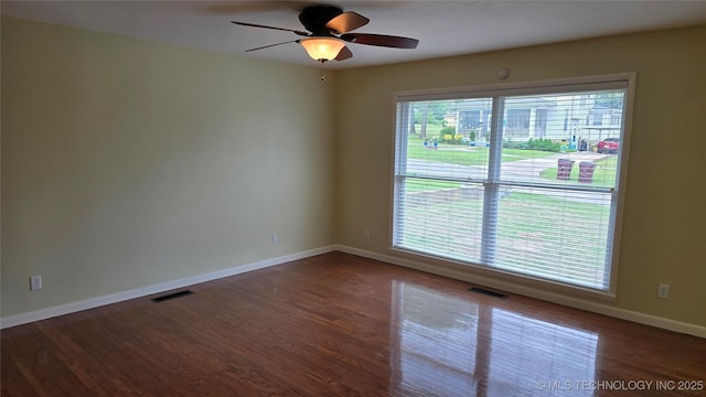 411 S 3rd, Eufaula, OK 74432 - empty room with baseboards, wood finished floors, and ceiling fan