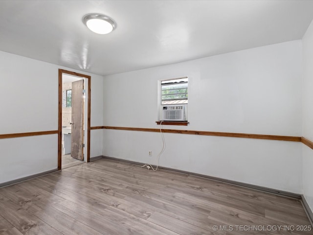 9 L B May Scenic Ln, Pawhuska, OK 74056 - spare room with wood finished floors, baseboards, and cooling unit