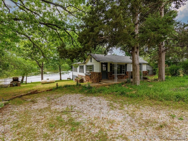 9 L B May Scenic Ln, Pawhuska, OK 74056 - rear view of property with stone siding and a porch