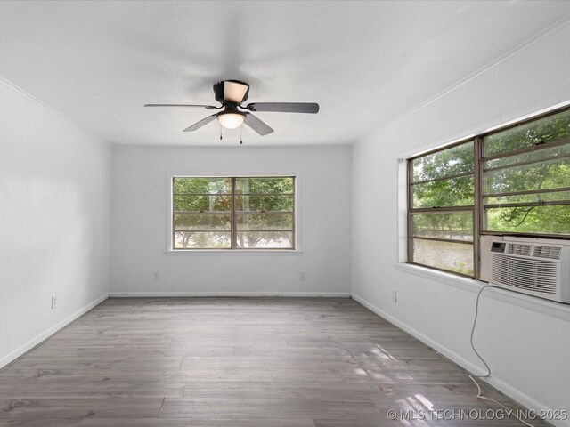 9 L B May Scenic Ln, Pawhuska, OK 74056 - unfurnished room with a ceiling fan, wood finished floors, cooling unit, and baseboards
