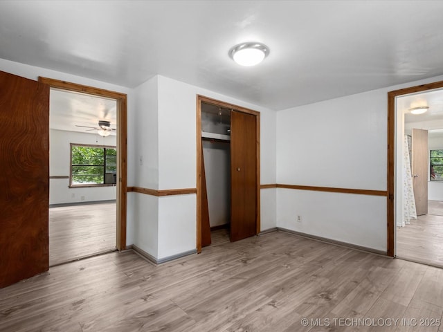 9 L B May Scenic Ln, Pawhuska, OK 74056 - unfurnished bedroom with wood finished floors, baseboards, and a closet