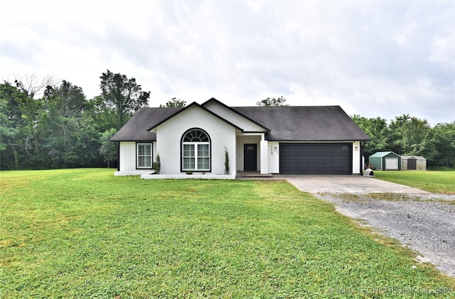 119 N 6th Mile, Fort Gibson, OK 74434 - ranch-style home featuring a shed, gravel driveway, an attached garage, a front yard, and an outdoor structure