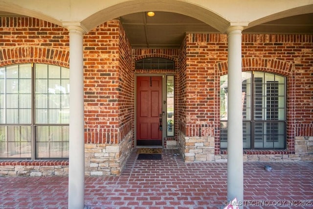 property entrance with brick siding