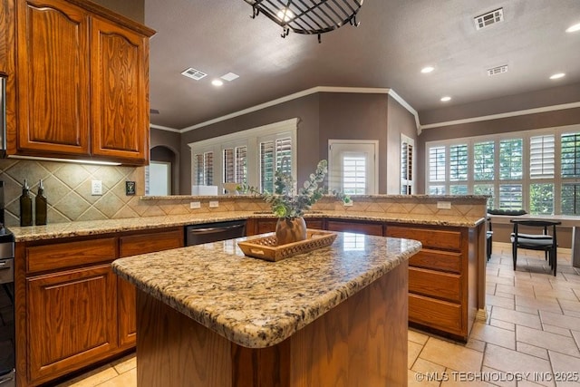 kitchen with a kitchen island, ornamental molding, dishwasher, recessed lighting, and backsplash