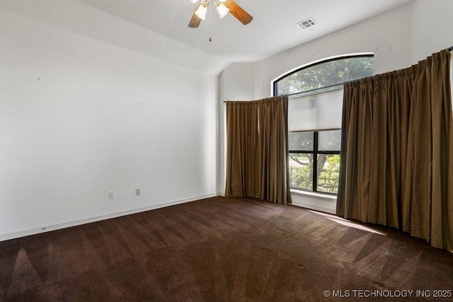 unfurnished room featuring carpet flooring, a ceiling fan, and vaulted ceiling
