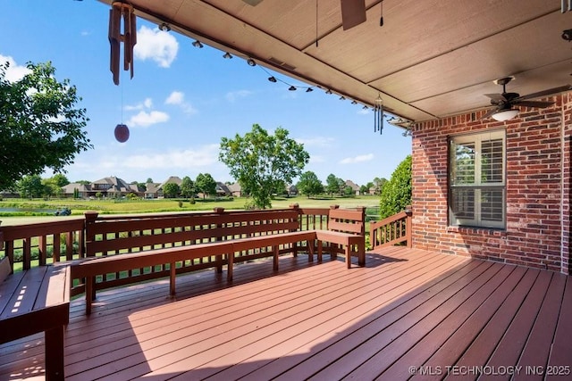 wooden deck with ceiling fan