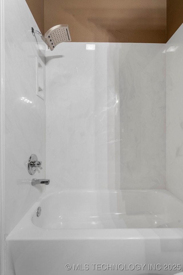 bathroom with washtub / shower combination
