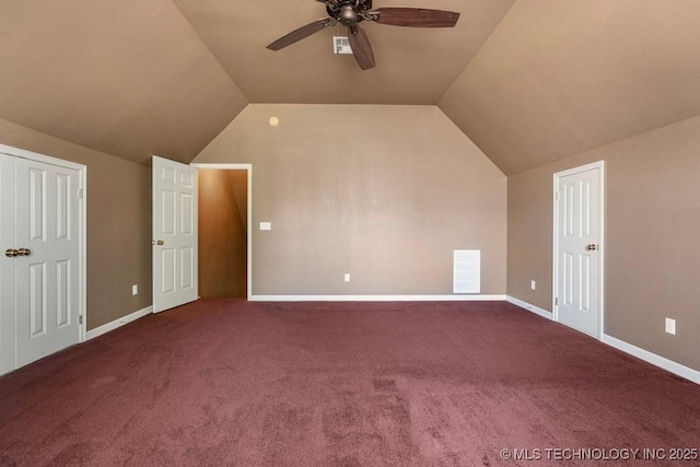 additional living space featuring a ceiling fan, lofted ceiling, carpet floors, and baseboards
