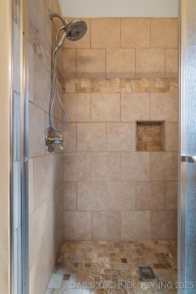 bathroom featuring a shower stall