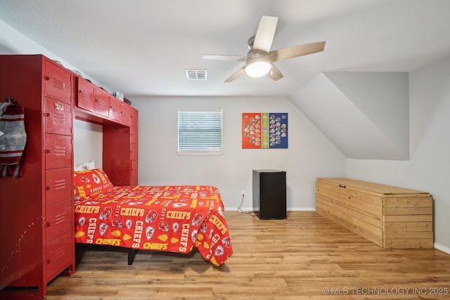 bedroom featuring light wood-type flooring, ceiling fan, and baseboards