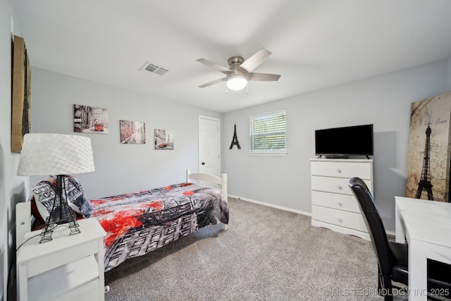 carpeted bedroom featuring ceiling fan and baseboards