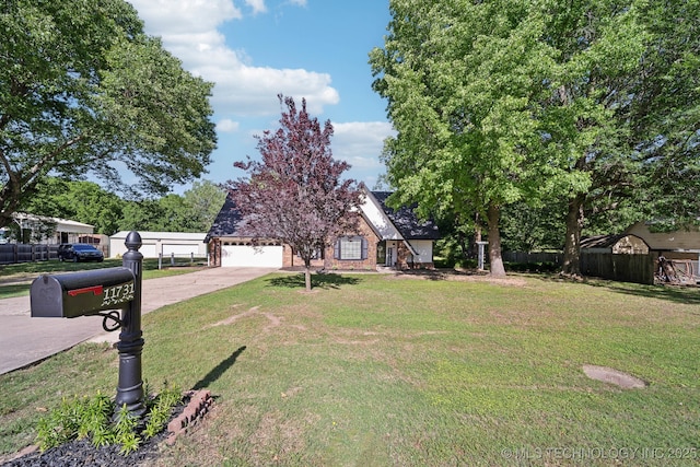 view of front of house featuring driveway, brick siding, and a garage