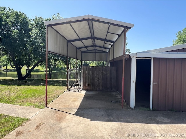 514 Lakeshore St, Durant, OK 74701 - view of vehicle parking with a carport and a water view