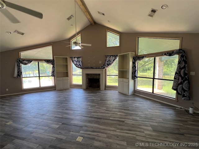 514 Lakeshore St, Durant, OK 74701 - unfurnished living room featuring ceiling fan, beamed ceiling, baseboards, a tiled fireplace, and high vaulted ceiling