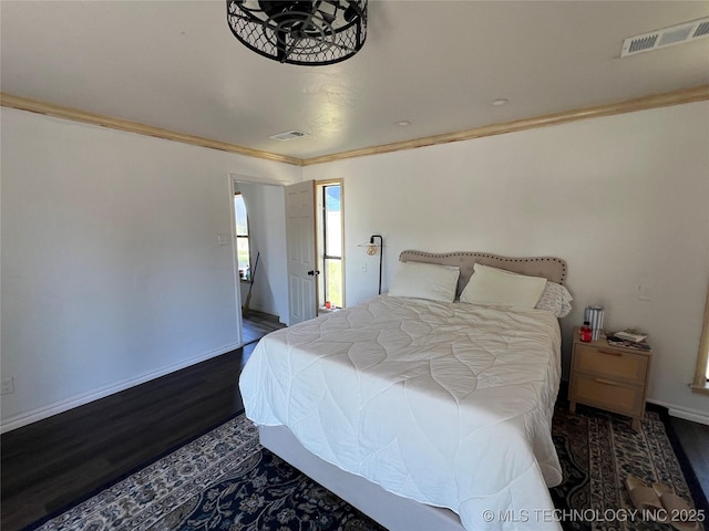514 Lakeshore St, Durant, OK 74701 - bedroom with wood finished floors, ornamental molding, and baseboards